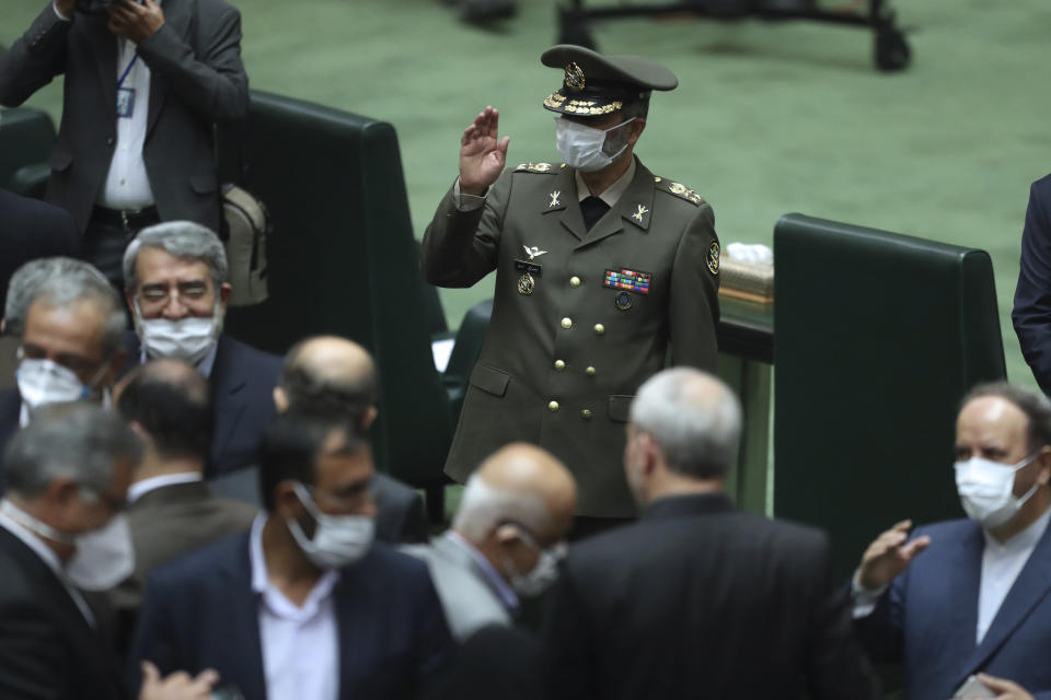 Commander of the Iranian Army Gen. Abdolrahim Mousavi wears a protective face mask to help prevent the spread of the coronavirus waves as he arrives for the inauguration of the new parliament, in Tehran, Iran, Wednesday, May, 27, 2020. Iran has convened its newly elected parliament, dominated by conservative lawmakers and under strict social distancing regulations, as the country struggles to curb the spread of coronavirus that has hit the nation hard. Iran is grappling with one of the deadliest outbreaks in the Middle East. (AP Photo/Vahid Salemi)