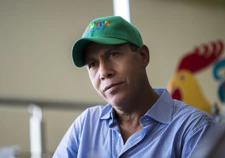 Lara state governor Henri Falcon listens during an interview with Reuters in Barquisimeto, Venezuela June 11, 2015. REUTERS/Marco Bello