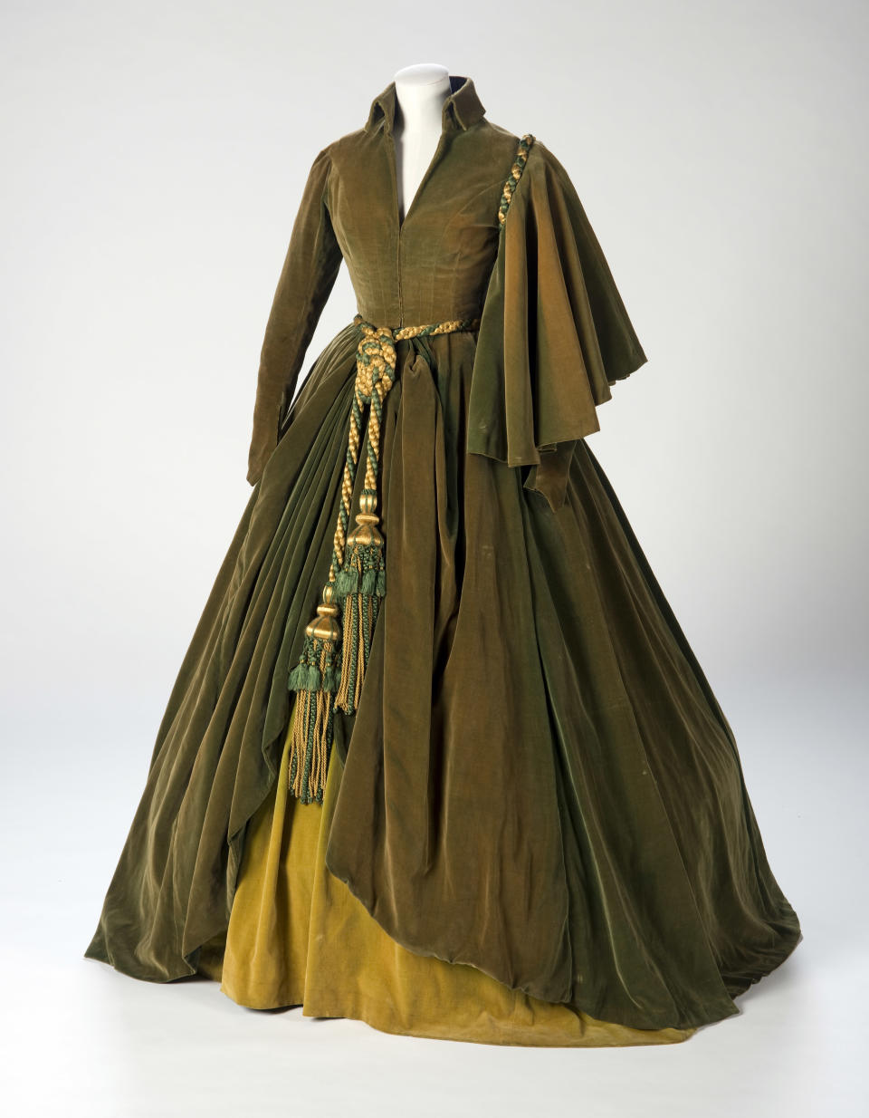 This undated photo provided by the Harry Ransom Center shows the conserved green curtain dress worn by Vivien Leigh as Scarlett O'Hara in "Gone With The Wind". The iconic dress and Scarlett's burgundy ball gown from the 1939 film were saved from deterioration by a $30,000 conservation effort by the Harry Ransom Center at the University of Texas, and are on display for the first time in nearly 30 years at London's Victoria and Albert Museum as part of a Hollywood costume exhibit. (AP Photo/Harry Ransom Center,Pete Smith)