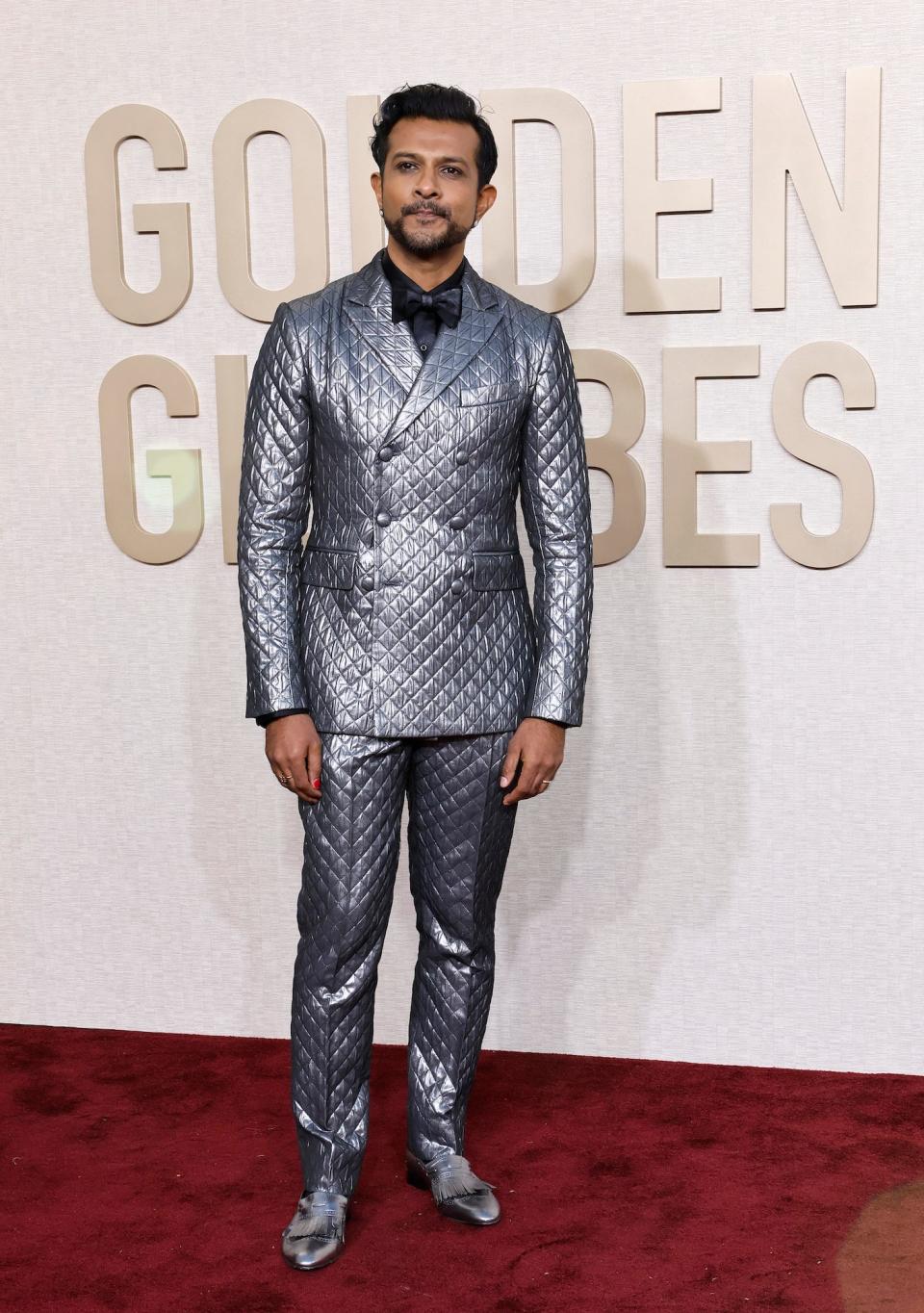 Utkarsh Ambudkar attends the 2024 Golden Globes.