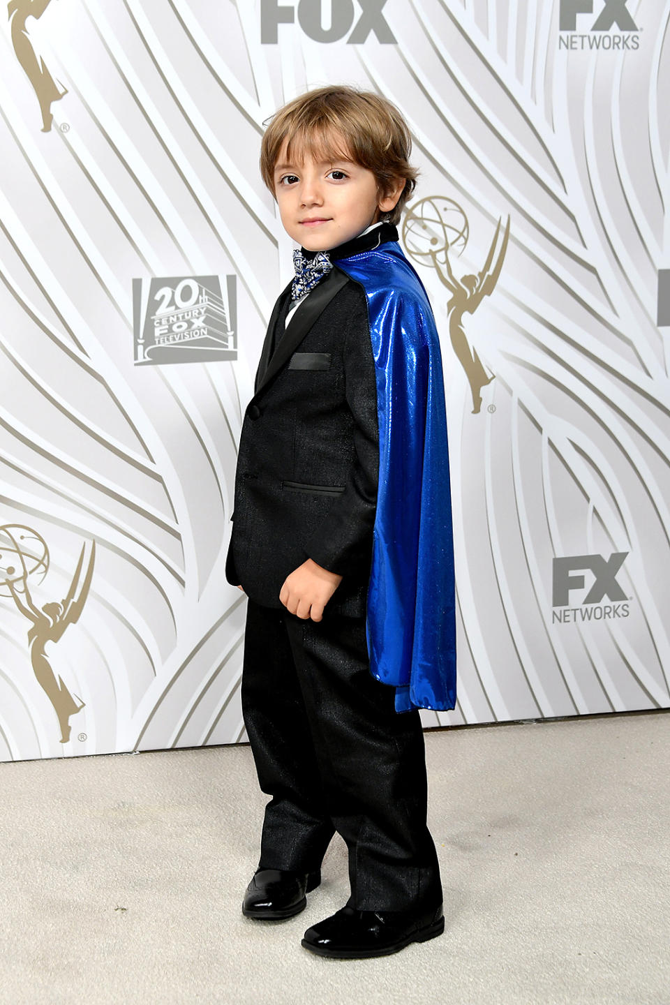 <p><em>Modern Family</em> cutie Jeremy Maguire, in his scene-stealing cape, attended the Fox Broadcasting Co., Twentieth Century Fox Television, FX, and <em>National Geographic</em> bash. (Photo: Neilson Barnard/Getty Images) </p>