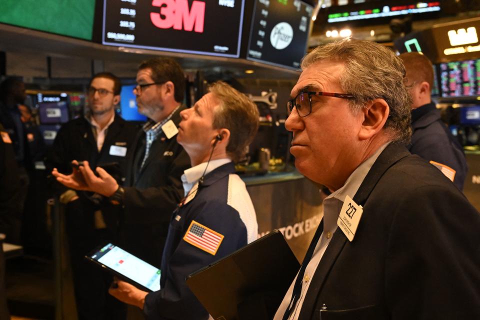 Traders work on the floor of the New York Stock Exchange (NYSE) during morning trading on March 13, 2023 in New York City. - US stocks slumped Monday with key indices markedly lower amid worries over the banking system following the collapse of Silicon Valley Bank and shuttering of Signature Bank. (Photo by TIMOTHY A. CLARY / AFP) (Photo by TIMOTHY A. CLARY/AFP via Getty Images)