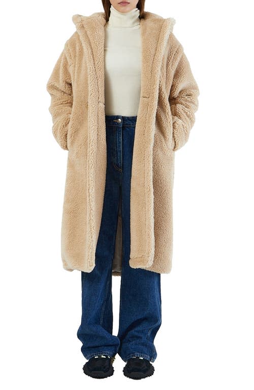 Shearling Coats to Bundle Up in The Frigid Temps This Winter