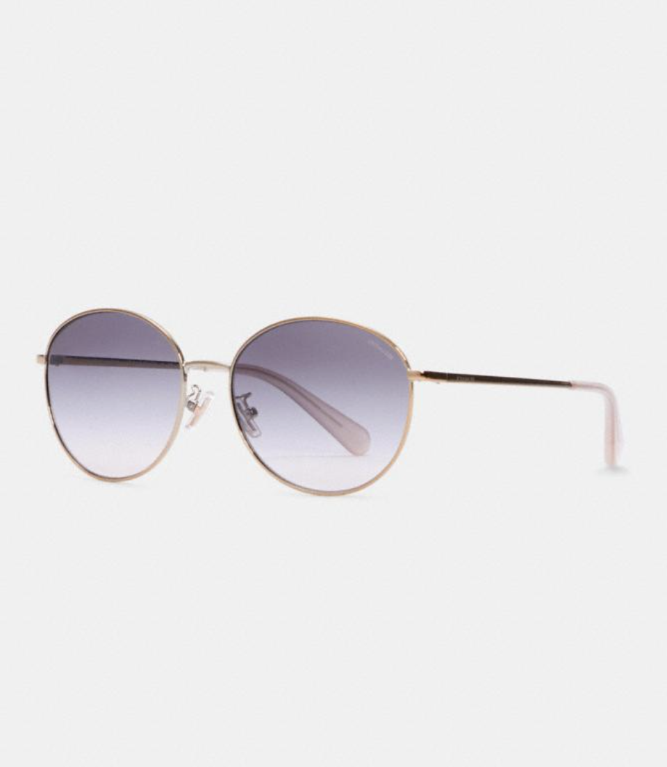 Lia Round Sunglasses in Violet Gradient (Photo via Coach Outlet)
