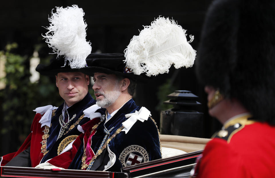 Prince William and Spain's King Felipe sit in a carriage after the Order of the Garter service. (Photo: ASSOCIATED PRESS)