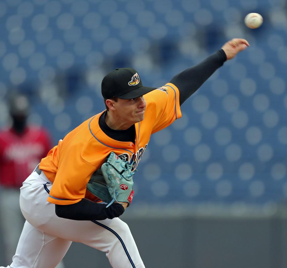 Akron RubberDucks starting pitcher Logan Allen throws against the Altoona Curve during the first inning of an MiLB baseball game at Canal Park on Wednesday.