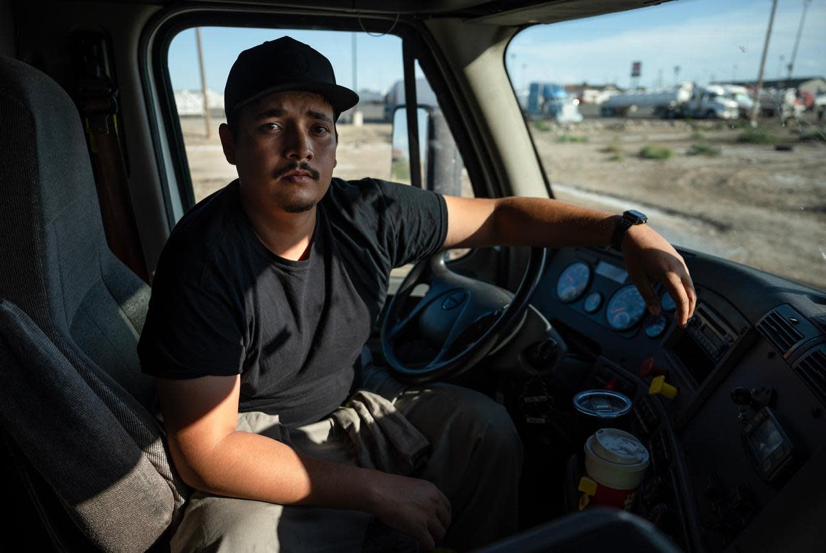 Cesar Adrian Gonzalez Lopez, a driver for Toreados Trucking LLC, a New Mexico based company, poses for a photo Wednesday, June 26, 2024 in Monahans.