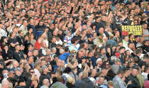 Protesters gather for a far-right protest in Chemnitz, Germany, Monday, Aug. 27, 2018 after a man has died and two others were injured in an altercation between several people of "various nationalities" in the eastern German city of Chemnitz on Sunday. (AP Photo/Jens Meyer)