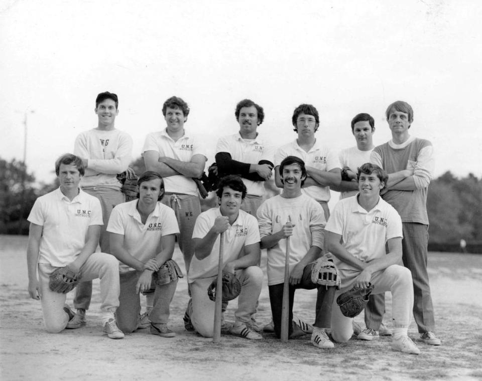 Roy Williams (kneeling, second from right) briefly sported a mustache while a graduate student at UNC. The undated photo shows Williams and other members of his graduate school intramural softball team at UNC.