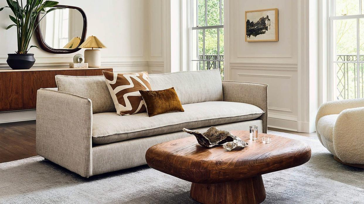 a living room with a couch and coffee table