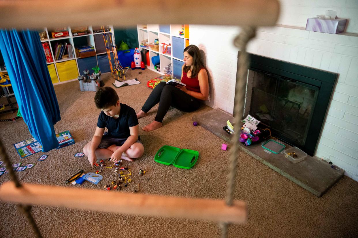 Kai and Cassie Atallah work together to learn about the constelations during Kai's homeschool lesson Friday, Sept. 9, 2022. Kai has been diagnosed with autism and has been homeschooled for the last two and a half years after being restrained and secluded in his previous school. His mother has become and advocate against those practices.