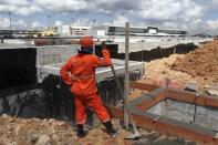 A labourer works at Manaus airport in Manaus June 2, 2014. REUTERS/Bruno Kelly