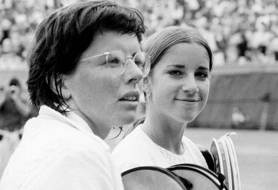 Sixteen-year-old Chris Evert, right, talks with Billie Jean King after losing to King, 6-3, 6-2 in the 1971 U.S. Open semifinals at Forest Hills Tennis Stadium in New York. King and eight other women signed $1 contracts in September 1970 to form a women's tennis circuit. The WTA Tour now offers 55 events in 29 countries and $179 million in total prize money.
