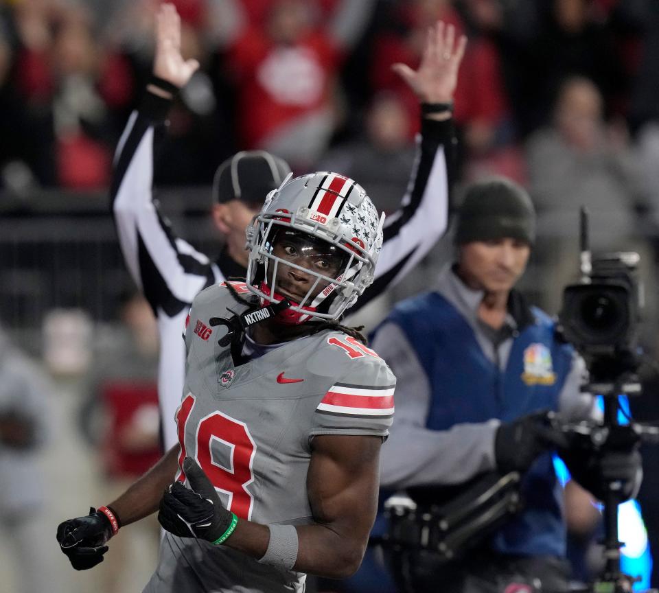 Nov. 11, 2023; Columbus, Oh., USA; 
Ohio State Buckeyes wide receiver Marvin Harrison Jr. (18) scores a touchdown during the first half of Saturday's NCAA Division I football game against the Michigan State Spartans.