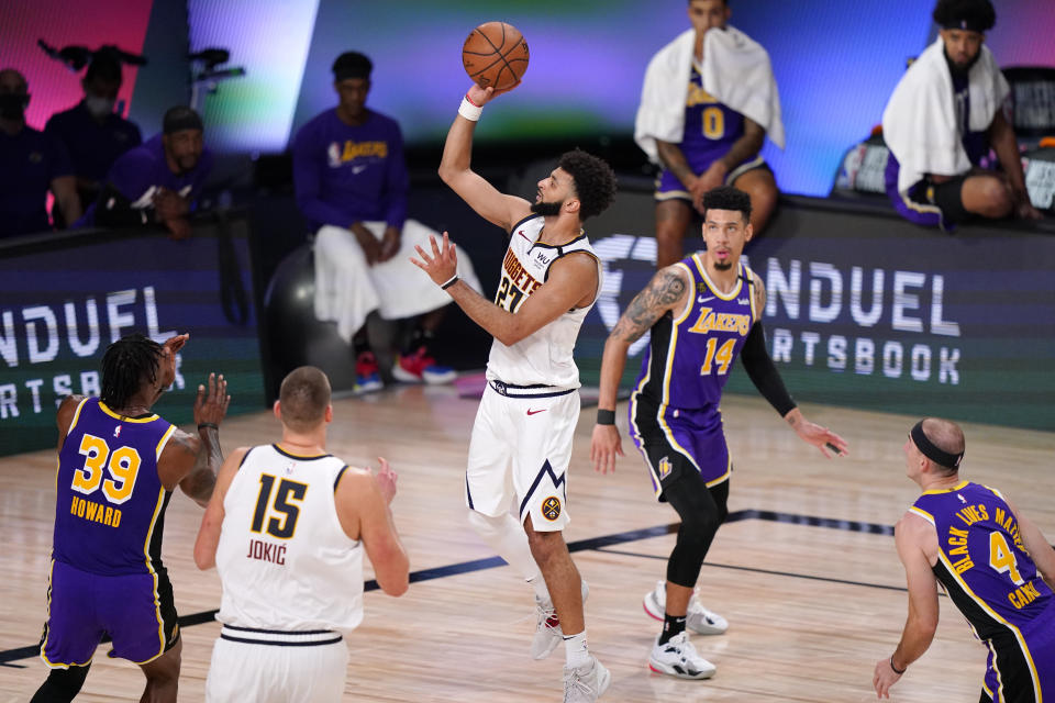 Denver Nuggets' Jamal Murray (27) shoots ahead of Los Angeles Lakers' Danny Green (14) during the second half of an NBA conference final playoff basketball game Saturday, Sept. 26, 2020, in Lake Buena Vista, Fla. (AP Photo/Mark J. Terrill)