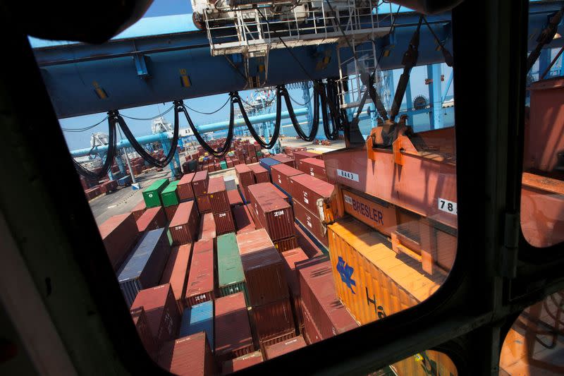 FILE PHOTO: Containers are seen through the window of a crane operator's booth at the port of the northern city of Haifa