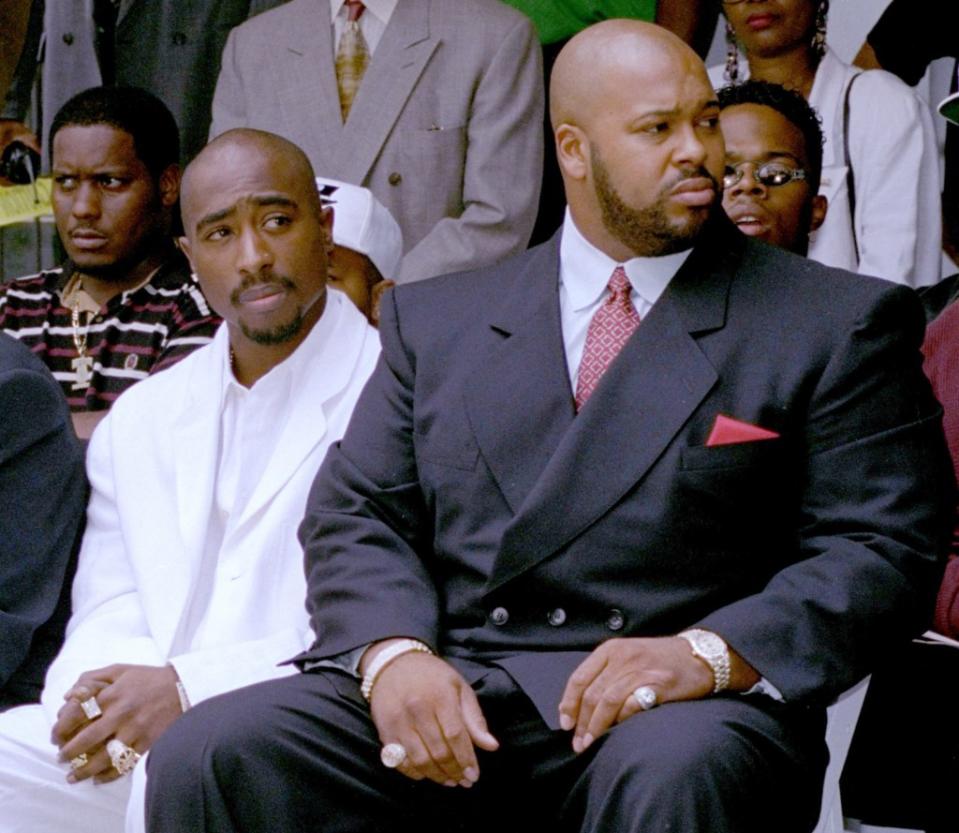 Knight with rapper Tupac Shakur (left) at an event in Los Angeles on Aug.15, 1996. AP