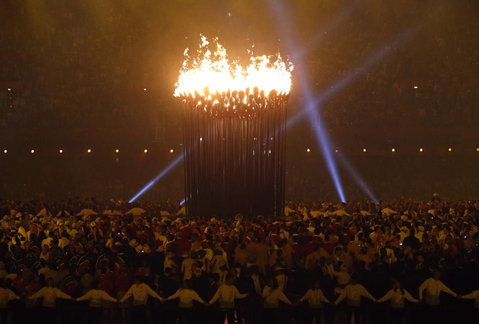 The Olympic cauldron is lit during the Opening Ceremony at the 2012 Summer Olympics, Saturday, July 28, 2012, in London. (AP Photo/Jae C. Hong)