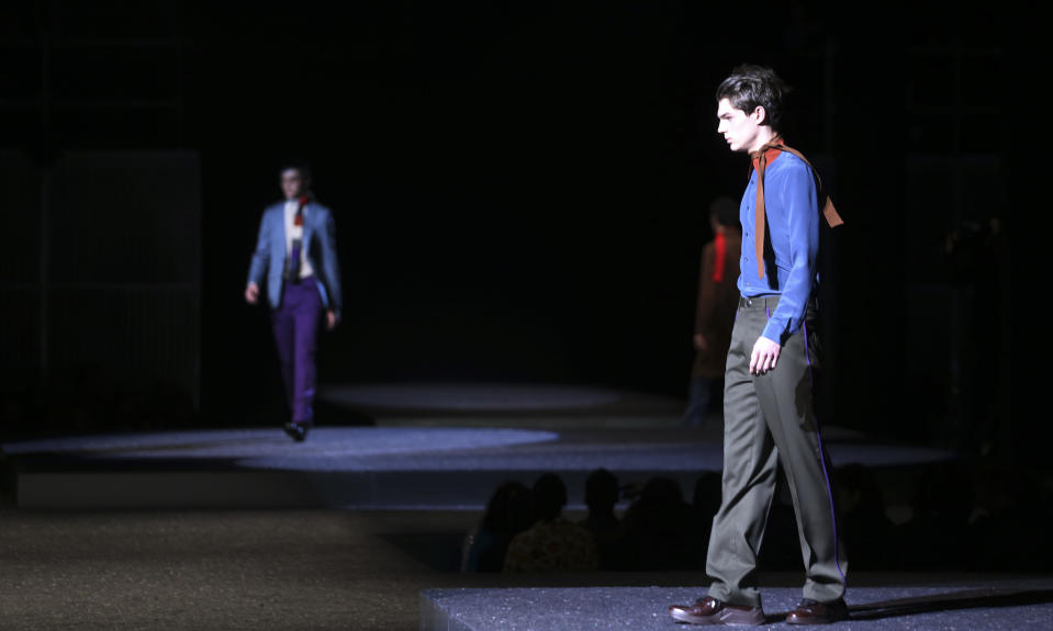 A model wears a creation for Prada men's Fall-Winter 2014 collection, part of the Milan Fashion Week, unveiled in Milan, Italy, Sunday, Jan.12, 2014. (AP Photo/Luca Bruno)