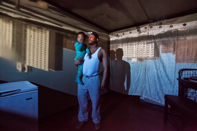 Joshua Mann poses for a portrait with his son in East New York, a low-income neighborhood in Brooklyn, on March 29, 2015. <a href="http://www.theatlantic.com/photo/2016/09/Phyllis-B-Dooney-Photographs-Raising-East-New-York/501305/?utm_source=yahoo" rel="nofollow noopener" target="_blank" data-ylk="slk:See more from photographer Phyllis B. Dooney here;elm:context_link;itc:0;sec:content-canvas" class="link ">See more from photographer Phyllis B. Dooney here</a>.