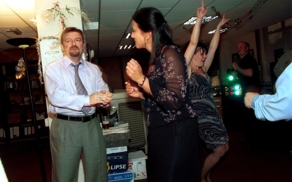 Ricky Gervais as David Brent, Sandy Hendrickse as Carol (Brent's date for the Christmas party) and Rachel Isaac as Trudy