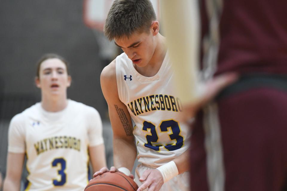 Ryan Shaffer (23) shoots a free throw during Waynesboro's game against State College in the Mid-Penn Semifinals at East Pennsboro on Tuesday, February 14, 2023