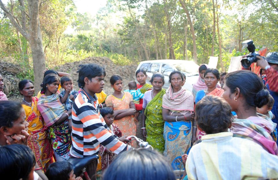 Santhal tribal women gather in a village where a woman was gang raped, allegedly on the direction of a village council at Subalpur, in Birbhum district, about 180 kilometers (110 miles) north of Kolkata, the capital of the eastern Indian state of West Bengal, Friday, Jan. 24, 2014. These unelected and unregulated courts now are coming under fresh scrutiny after police say a council of elders in West Bengal ordered the gang rape of a 20-year-old woman as punishment for falling in love with the wrong man. (AP Photo)