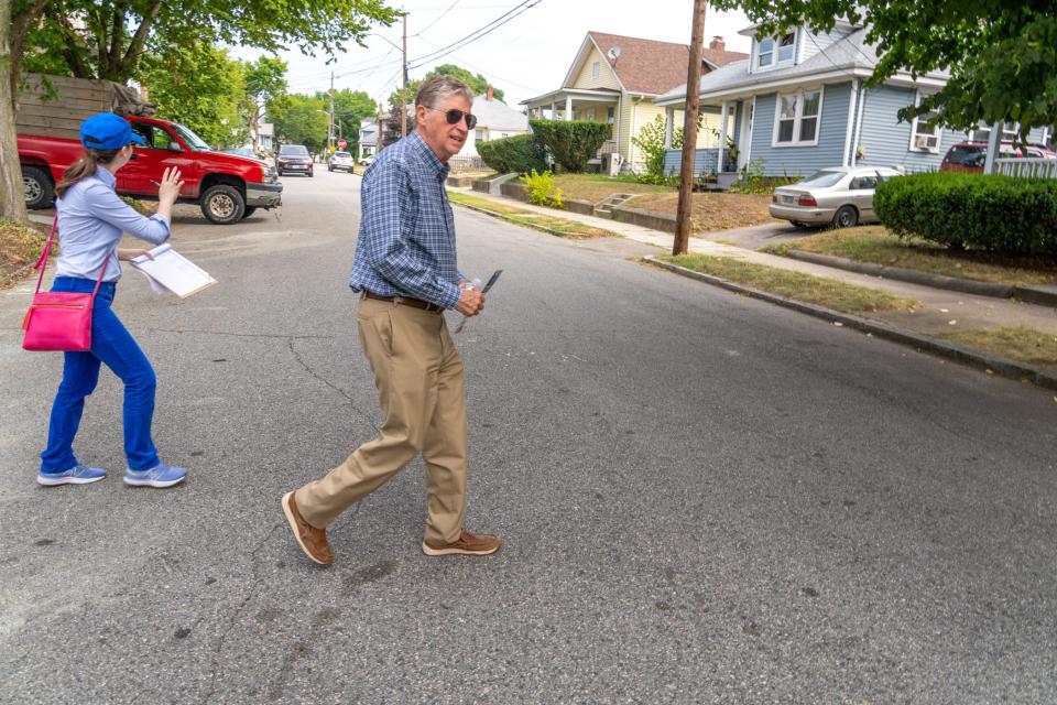 Gov. Dan McKee canvasses in the Smith Hill neighborhood of Providence on Aug. 20.