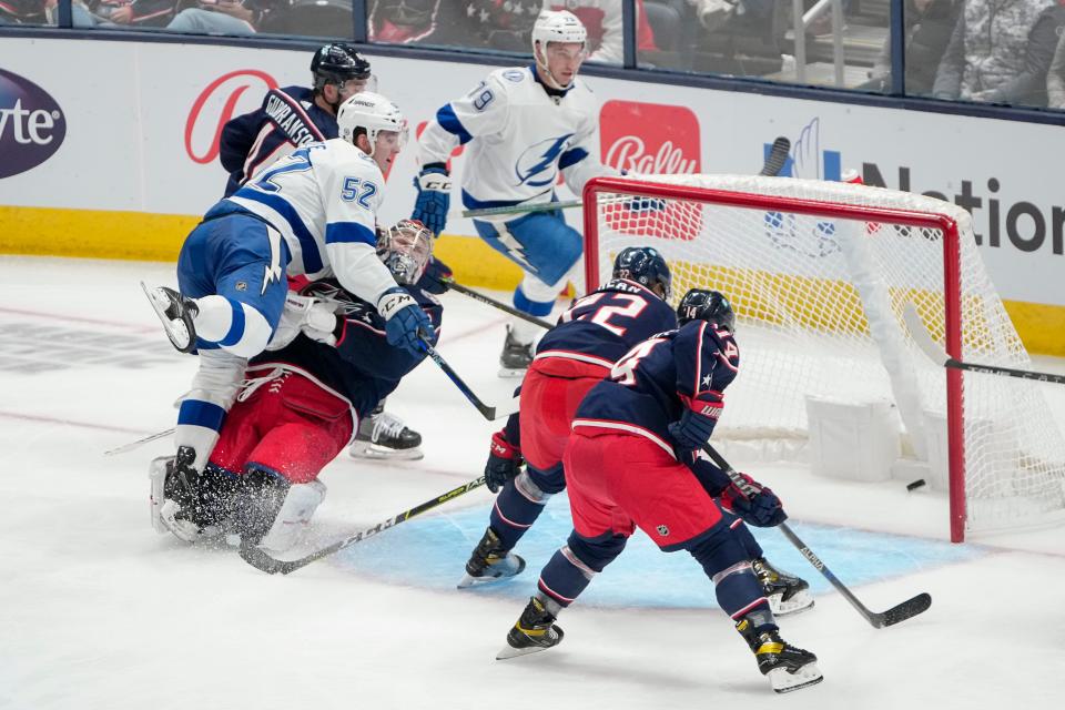 Oct 14, 2022; Columbus, Ohio, USA;  Tampa Bay Lightning defenseman Cal Foote (52) scores a goal past Columbus Blue Jackets goaltender Daniil Tarasov (40) during the second period of the NHL hockey game at Nationwide Arena. Mandatory Credit: Adam Cairns-The Columbus Dispatch