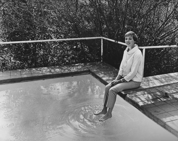 <p>Julie Andrews, poolside in November, wore capris and a casual high-collared blouse for a free-spirited ensemble.</p>