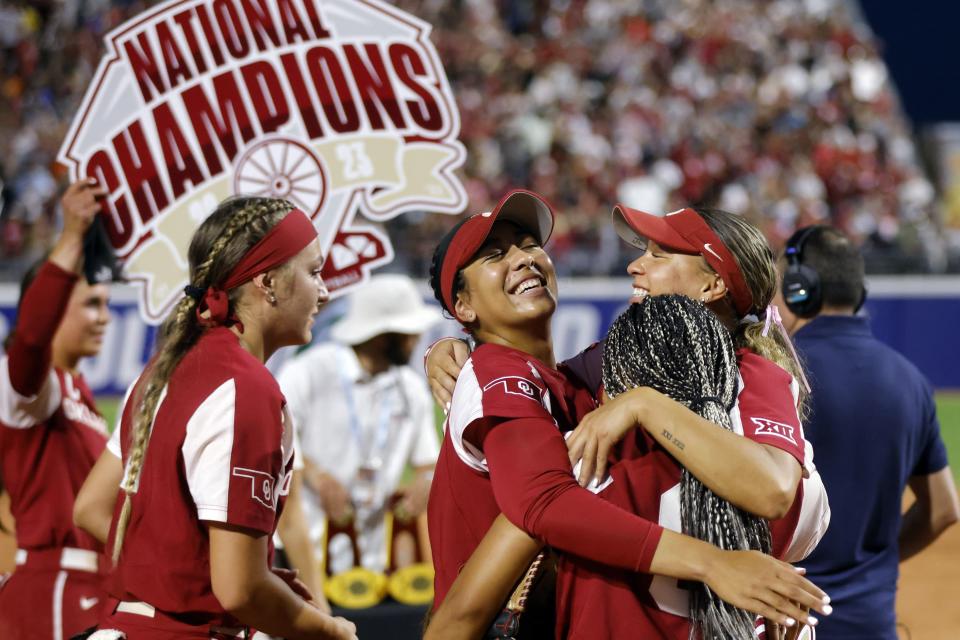 Oklahoma’s Kinzie Hansen, Tiare Jennings, Rylie Boone and Jayda Coleman celebrate, from left, celebrate the team’s win over Florida State in the NCAA Women’s College World Series softball championship series Thursday, June 8, 2023, in Oklahoma City. The Sooners were the toast of the Big 12 — and the nation — in 2023. | Nate Billings, Associated Press