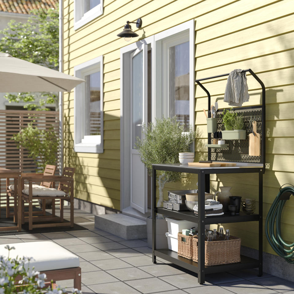 An outdoor kitchen unit on a patio