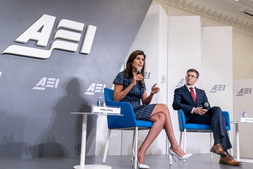 Republican presidential candidate Nikki Haley, accompanied by American Enterprise Institute Senior Fellow Zack Cooper, right, speaks at American Enterprise Institute, Tuesday, June 27, 2023, in Washington. (AP Photo/Andrew Harnik)