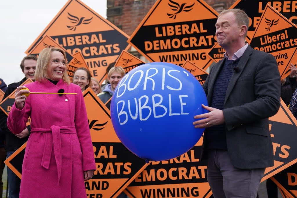 Newly elected Liberal Democrat MP Helen Morgan, bursts ‘Boris’ bubble’ held by colleague Tim Farron (Jacob King/PA) (PA Wire)