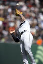 Chicago White Sox third baseman Yoán Moncada jumps to catch a popup by San Francisco Giants' Brandon Belt during the fourth inning of a baseball game, Sunday, July 3, 2022, in San Francisco. (AP Photo/D. Ross Cameron)