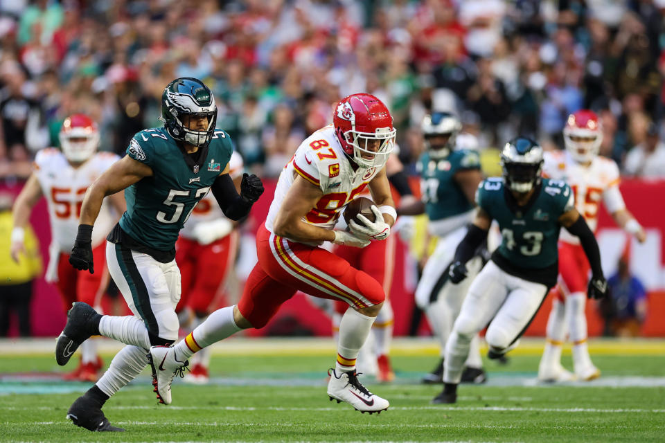 Travis Kelce #87 of the Kansas City Chiefs carries the ball against the Philadelphia Eagles during the first quarter of Super Bowl LVII on Feb. 12, 2023, in Glendale, Ariz. (Christian Petersen / Getty Images file)