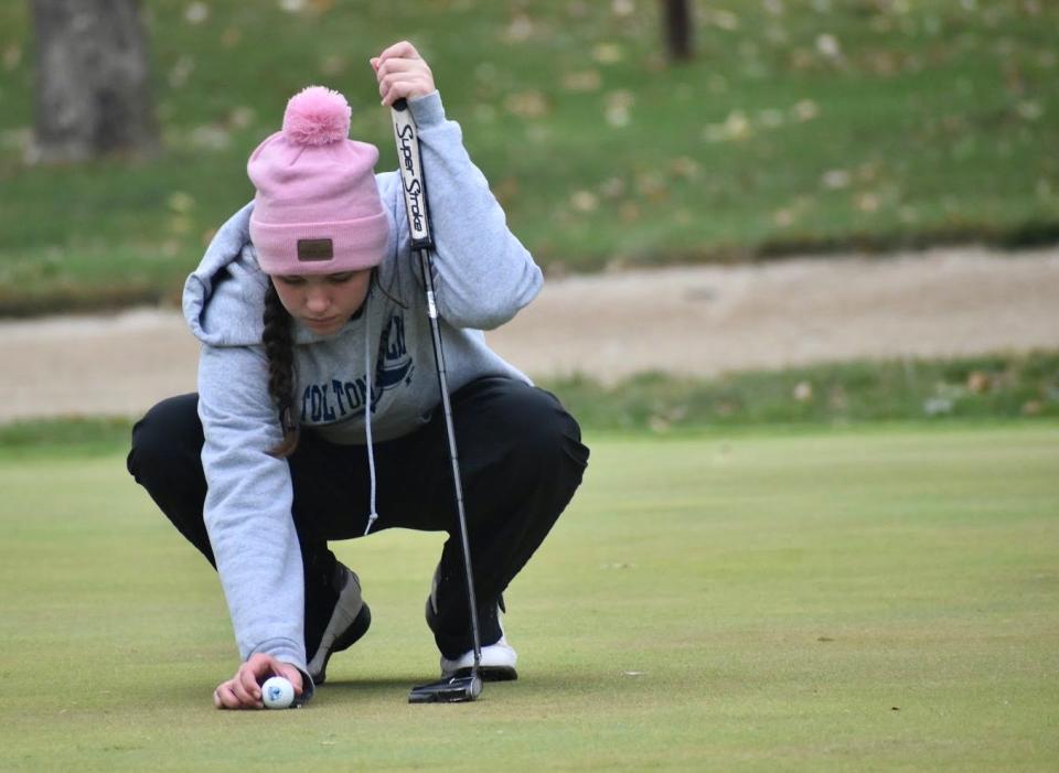 Tolton's Audrey Rischer positions the ball before making a putt on the 18th green during the Class 2 state championships in 2020 at Meadow Lake Acres Country Club in New Bloomfield.