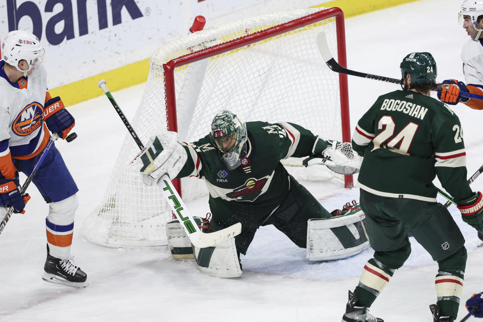 Minnesota Wild goaltender Marc-Andre Fleury defends the net against the New York Islanders during the third period of an NHL hockey game, Monday, Jan. 15, 2024, in St. Paul, Minn. (AP Photo/Stacy Bengs)