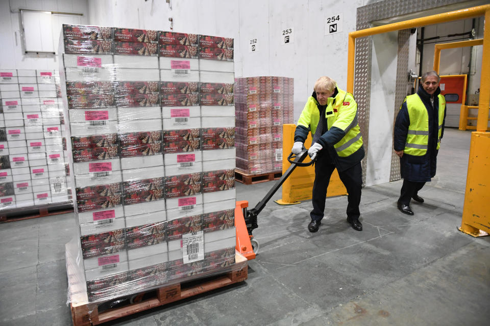 Prime Minister Boris Johnson hauling a consignment of frozen desserts during a visit to Iceland Foods HQ, Deeside, North Wales.