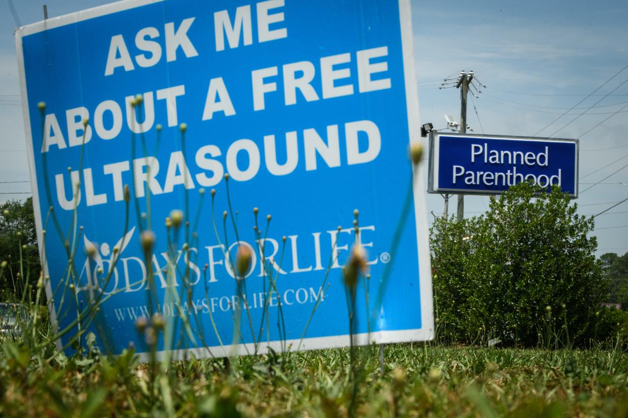 An anti-abortion sign sits out in front of a Planned Parenthood on Yadkin Road in Fayetteville, June 17, 2022.