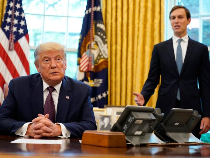 President Trump in the Oval Office with Jared Kushner speaking behind him.