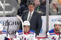 New York Rangers head coach Peter Laviolette stands behind his bench during the first period of an NHL hockey game against the Pittsburgh Penguins in Pittsburgh, Saturday, March 16, 2024. The Rangers won 7-4. (AP Photo/Gene J. Puskar)