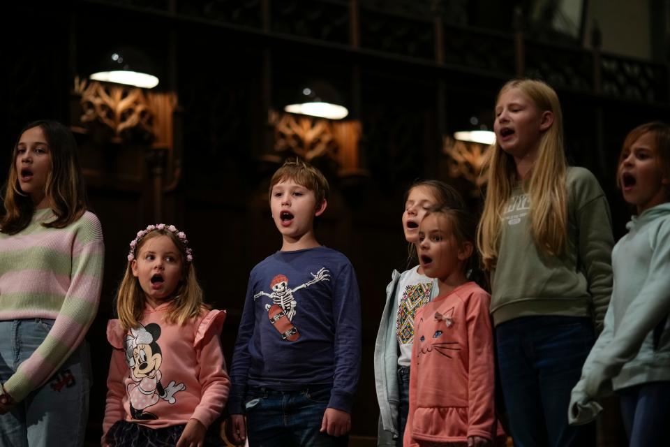 Dasha Tkachenko (far right) and other members of the Ukranian Children's Choir rehearse for a concert Saturday at First Congregational Church Downtown.