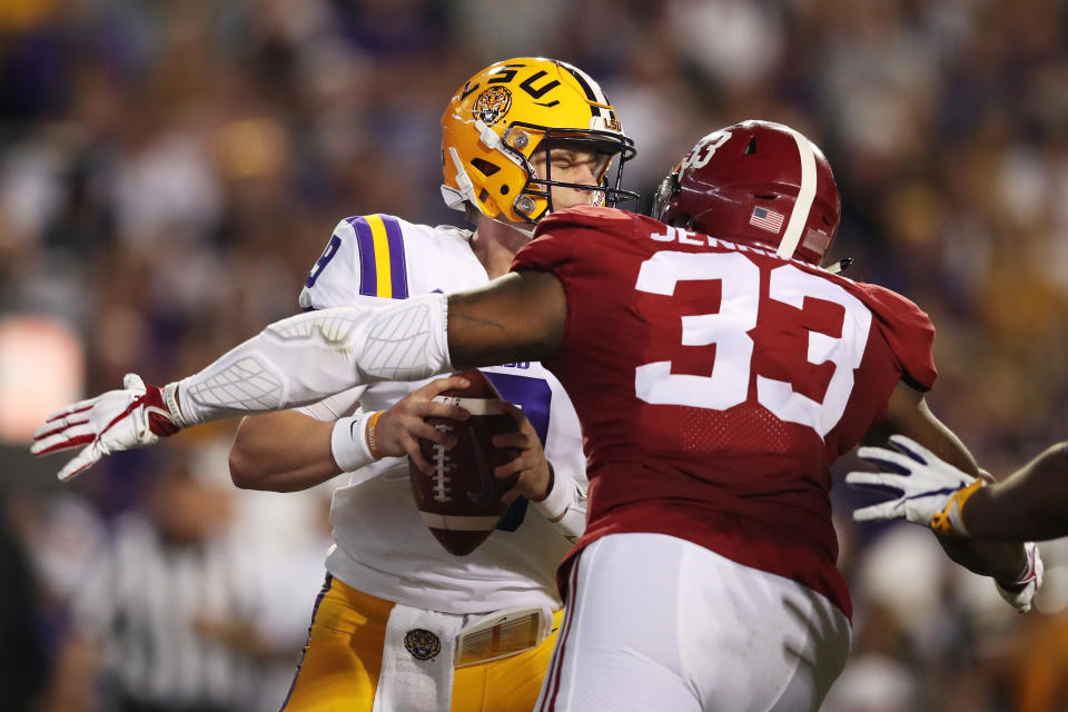 Anfernee Jennings prepares to devour Joe Burrow. (Photo by Gregory Shamus/Getty Images)