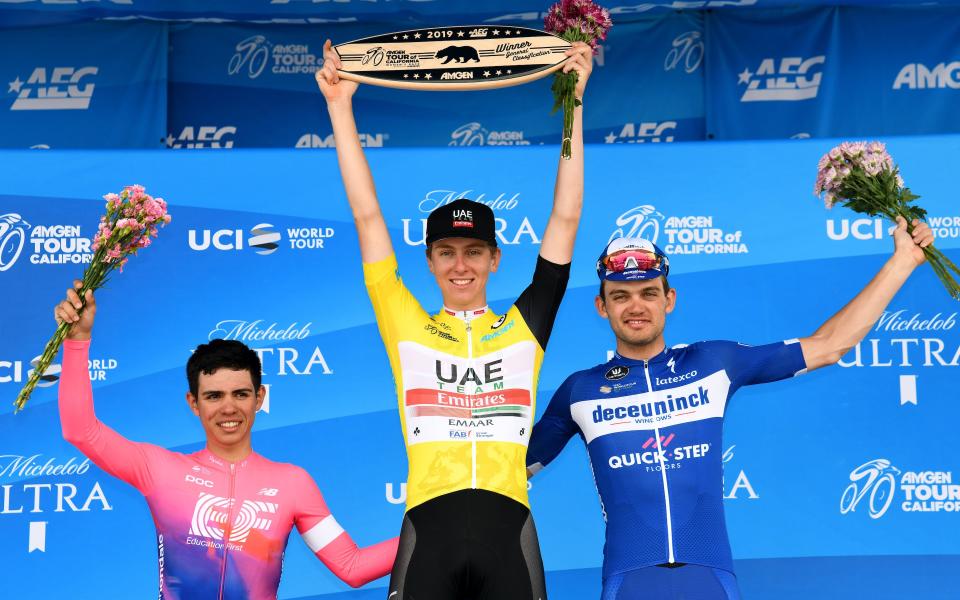 Tadej Pogacar is flanked by Sergio Higuita (left) and Kasper Asgreen on the winners' podium at the Tour of California - 2019 Getty Images