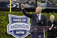 Former Seattle Seahawks quarterback Matt Hasselbeck motions after being introduced as one of the team's newest members of the team's "Ring of Honor" during halftime of an NFL football game against the New Orleans Saints, Monday, Oct. 25, 2021, in Seattle. (AP Photo/Ted S. Warren)