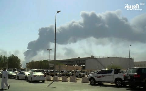 Smoke billows from a fire at a Saudi oil plant - Credit: Al-Arabiya via AP