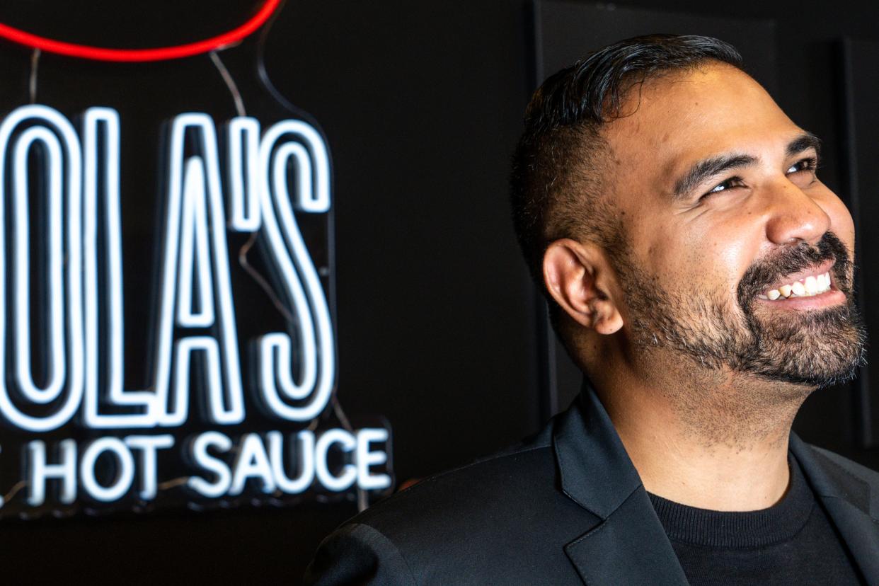 Taufeek Shah, founder of Lola's Fine Hot Sauce, at his office in West Des Moines