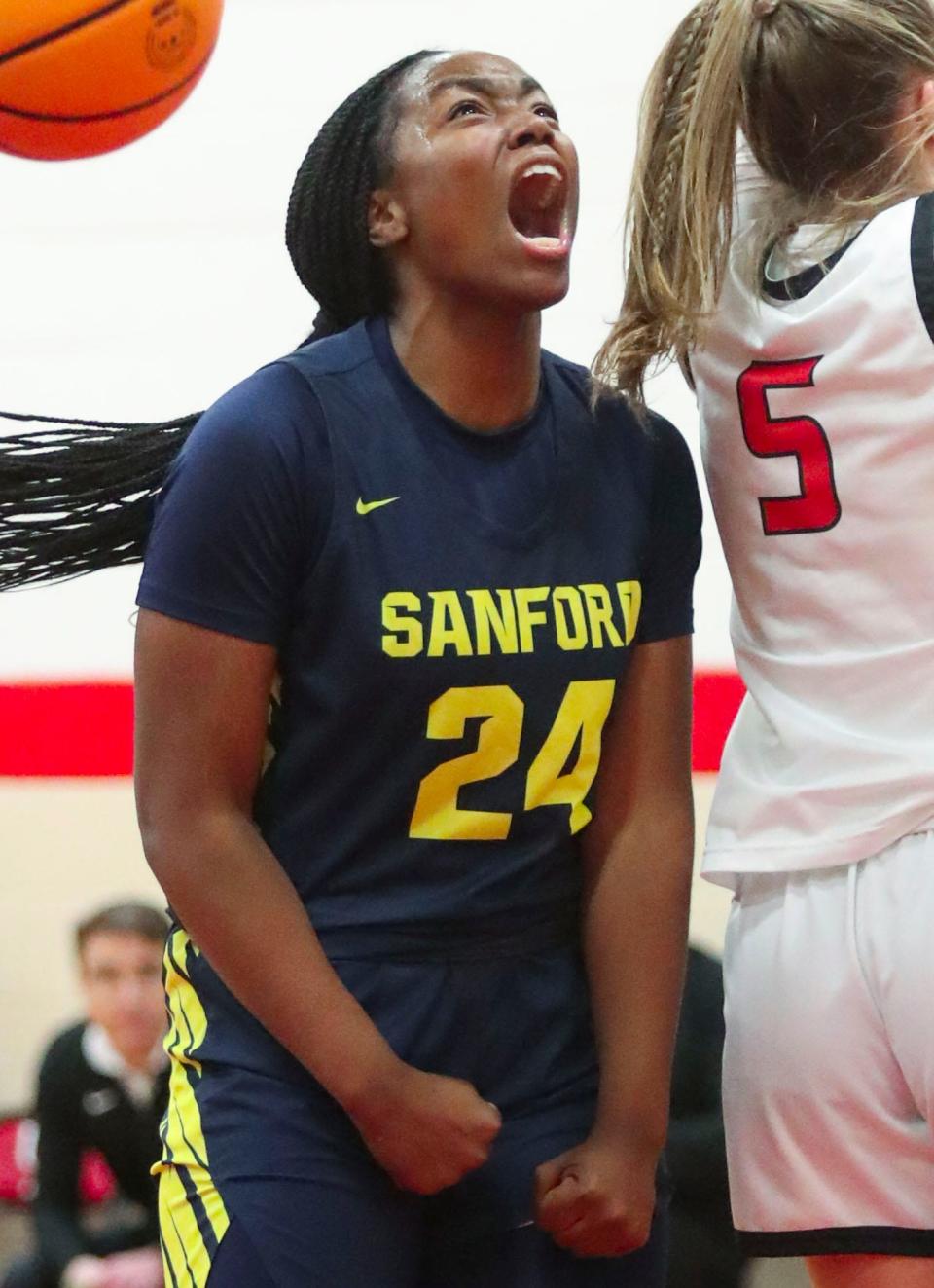 Sanford's Dallas Pierce reacts after scoring while being fouled in the first half of the Warriors' 59-51 win at Ursuline, Friday, Feb. 10, 2023.