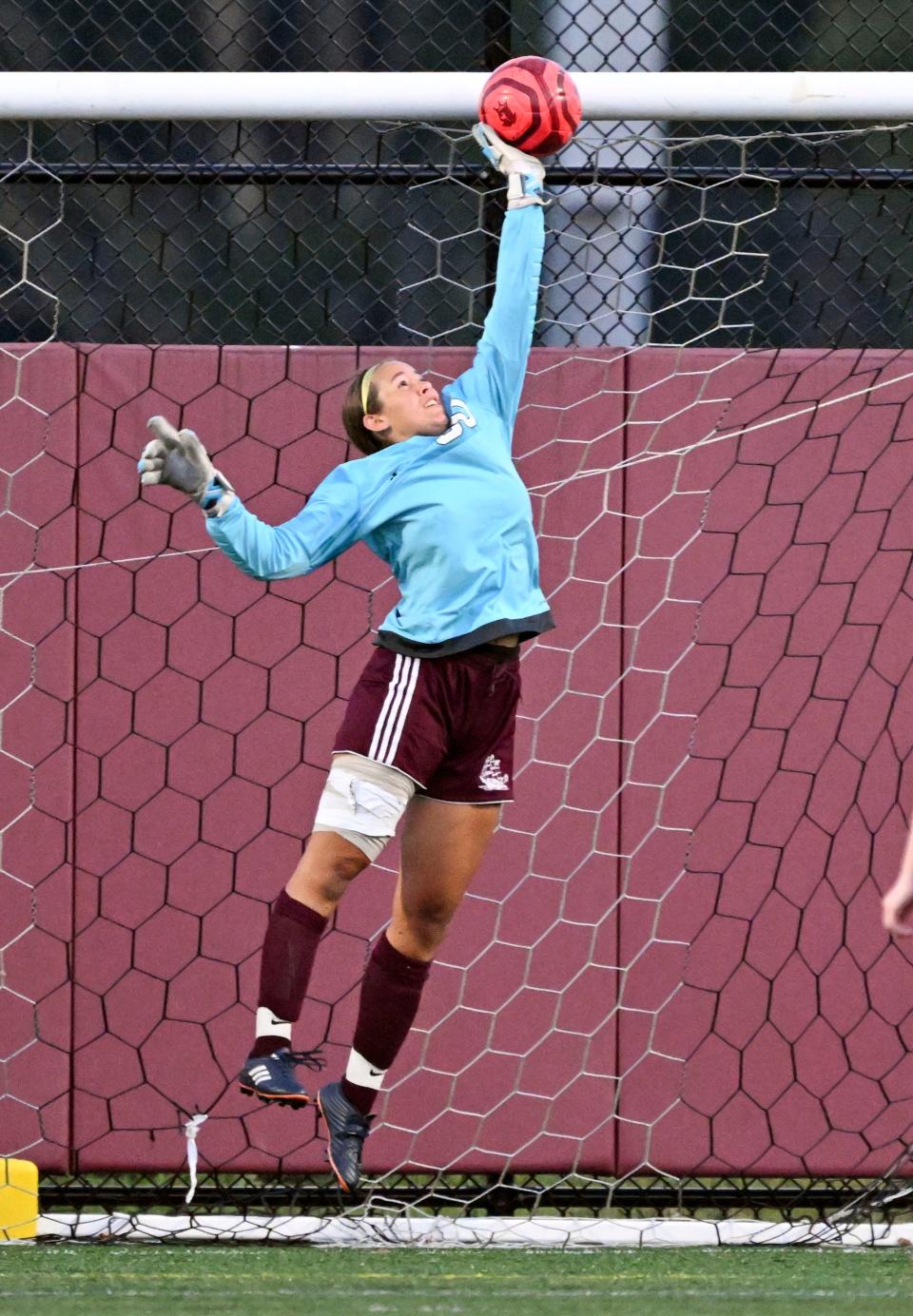 Falmouth goalie Riley Devlin deflects a Sandwich shot in the second half of the game Sandwich won 2-0.